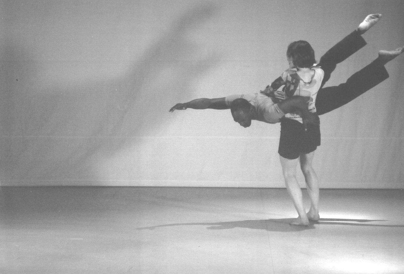 Boris Willis balanced horizontally across a standing partner