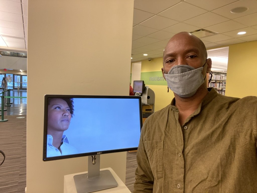 Boris Willis beside a monitor showing a MetaHuman in the gallery