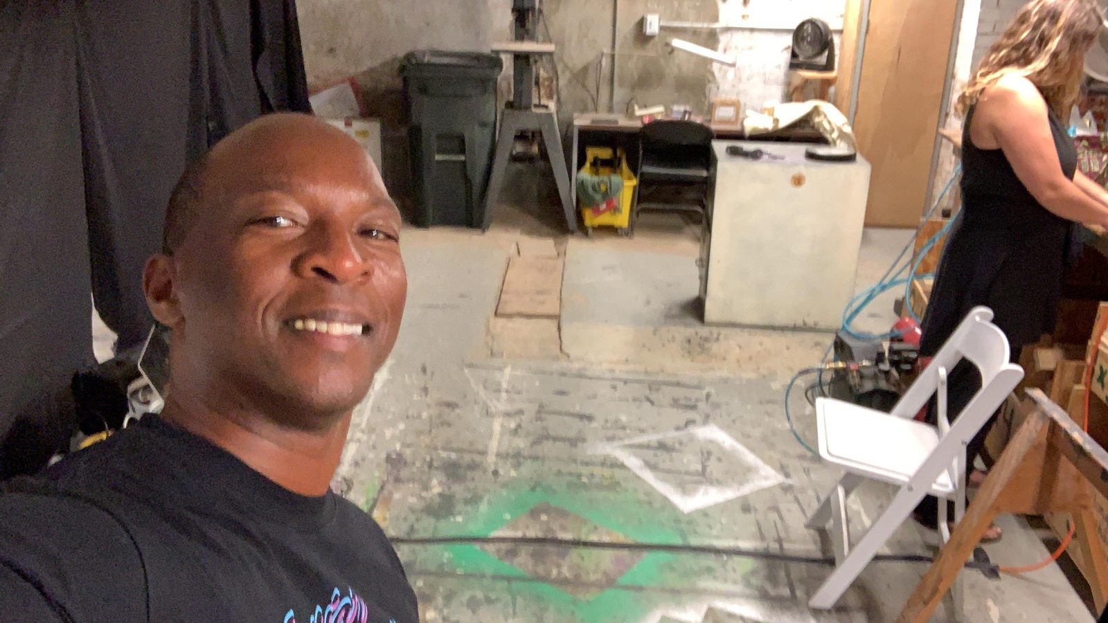Boris Willis in the rehearsal space with glow-taped marks on the floor